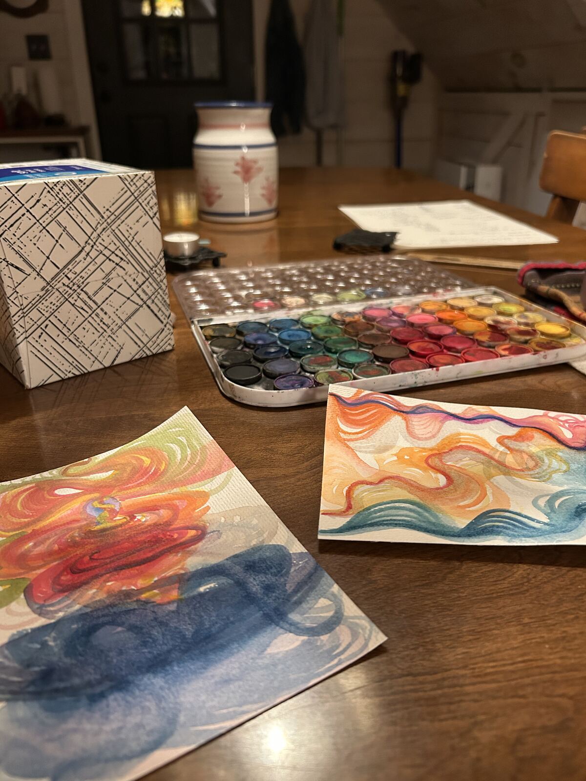 Warm spiral watercolor study in orange and blue, paired with a timeline piece