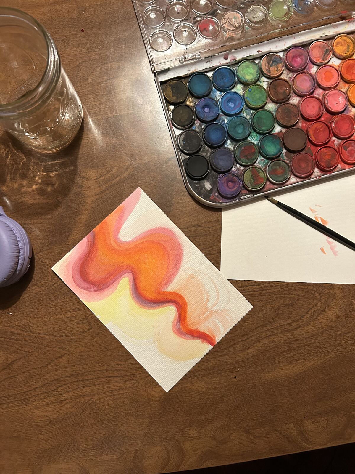 Small watercolor study of an orange-pink wavy energy ribbon
